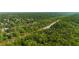 Aerial view of the river running through the trees with homes in the distance at 900 Edgewater Nw Dr, Atlanta, GA 30328