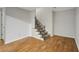 Basement entrance featuring stairs and a wood look floor in a home for sale at 900 Edgewater Nw Dr, Atlanta, GA 30328