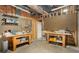 Unfinished basement area featuring pegboard and worktables ready for customization at 900 Edgewater Nw Dr, Atlanta, GA 30328