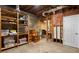 Unfinished basement featuring exposed beams, shelving, and a concrete floor at 900 Edgewater Nw Dr, Atlanta, GA 30328
