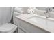 Well-lit bathroom with white vanity, marble countertop, and modern fixtures at 900 Edgewater Nw Dr, Atlanta, GA 30328