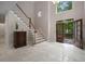 Bright foyer with tile floors, staircase and views of front yard through double front doors at 900 Edgewater Nw Dr, Atlanta, GA 30328
