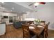 Open-concept kitchen and dining area with a large island, stainless appliances, and hardwood floors at 900 Edgewater Nw Dr, Atlanta, GA 30328