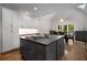 Well-appointed kitchen with a large island, stainless steel appliances and vaulted ceiling at 900 Edgewater Nw Dr, Atlanta, GA 30328