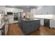 Gourmet kitchen with large island, granite countertops, stainless steel appliances and wine fridge at 900 Edgewater Nw Dr, Atlanta, GA 30328