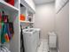 Efficient laundry room with modern washer and dryer, shelving, and convenient storage solutions at 900 Edgewater Nw Dr, Atlanta, GA 30328