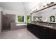 This primary bathroom boasts a standalone tub, walk-in shower, and double vanity with granite countertops at 900 Edgewater Nw Dr, Atlanta, GA 30328