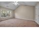 Vaulted ceiling main bedroom with carpet and natural lighting at 1538 Park Grove Dr, Lawrenceville, GA 30046