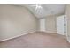 Spacious bedroom featuring a vaulted ceiling, neutral paint, and a ceiling fan for added comfort at 1538 Park Grove Dr, Lawrenceville, GA 30046