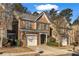 Charming two-story home featuring brick accents, well-maintained landscaping, and an attached one-car garage at 1538 Park Grove Dr, Lawrenceville, GA 30046