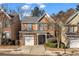 Charming two-story home featuring brick accents, well-maintained landscaping, and an attached one-car garage at 1538 Park Grove Dr, Lawrenceville, GA 30046