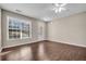 Spacious living room with hardwood floors, a fireplace, and a ceiling fan at 1538 Park Grove Dr, Lawrenceville, GA 30046