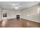 Spacious living room with hardwood floors, a fireplace, and a ceiling fan at 1538 Park Grove Dr, Lawrenceville, GA 30046