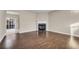 Spacious living room with hardwood floors, a fireplace, and a ceiling fan at 1538 Park Grove Dr, Lawrenceville, GA 30046