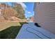 A backyard featuring a well-maintained lawn and a newly poured concrete patio at 20 Daniel Crk, Sugar Hill, GA 30518