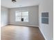 Neutral bedroom featuring wood floors, a large window, and fresh paint at 20 Daniel Crk, Sugar Hill, GA 30518