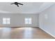 Large bedroom featuring wood floors, neutral walls, and two windows at 20 Daniel Crk, Sugar Hill, GA 30518