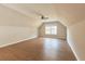 Large bonus room with wood flooring, a ceiling fan, neutral walls, and a window for natural light at 20 Daniel Crk, Sugar Hill, GA 30518