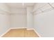 Walk-in closet with wood floors and wire shelving at 20 Daniel Crk, Sugar Hill, GA 30518
