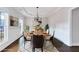 Staged dining room with modern decor, chandelier, and natural light, perfect for elegant dinners at 20 Daniel Crk, Sugar Hill, GA 30518