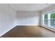 Bright and spacious room, highlighted by hardwood floors and two large windows that provide abundant natural light at 20 Daniel Crk, Sugar Hill, GA 30518