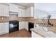Modern kitchen with stainless steel appliances, granite countertops and ample cabinet space at 20 Daniel Crk, Sugar Hill, GA 30518