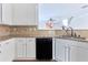 Kitchen with granite countertops and stainless steel appliances that leads to living room at 20 Daniel Crk, Sugar Hill, GA 30518
