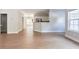 Open-concept layout with view from living room towards kitchen and hallway at 20 Daniel Crk, Sugar Hill, GA 30518