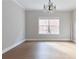 Bright, airy living room featuring a large window and a modern chandelier at 20 Daniel Crk, Sugar Hill, GA 30518