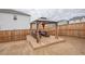 Backyard featuring outdoor living space on wooden platform with roof at 2718 Serena Way, Atlanta, GA 30331