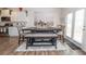 Bright dining area with modern decor, wood floors, and access to the backyard through glass doors at 2718 Serena Way, Atlanta, GA 30331