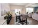 Dining area with stylish furniture, natural light, and a view into the living room at 2718 Serena Way, Atlanta, GA 30331