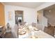 Dining room with a neutral color palette, decorative wall art and stylish table setting at 2718 Serena Way, Atlanta, GA 30331