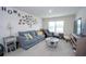 Cozy living room featuring comfortable blue sofa and charming decor at 2718 Serena Way, Atlanta, GA 30331