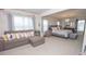Open concept living and bedroom area with neutral tones and stylish furniture at 2718 Serena Way, Atlanta, GA 30331