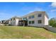 Large backyard with lush green grass and a screened-in porch, ideal for relaxing and enjoying the outdoors at 2989 Waterford Dr, Conyers, GA 30094