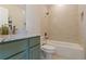 Bathroom with a modern tub, beautiful tiled shower, granite countertop, and a stylish vanity at 2989 Waterford Dr, Conyers, GA 30094
