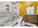 Bathroom featuring tiled shower, modern vanity, stylish mirror, and contrasting walls at 2989 Waterford Dr, Conyers, GA 30094