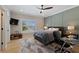 Bedroom featuring ceiling fan, bed, desk, and window letting in plenty of natural light at 2989 Waterford Dr, Conyers, GA 30094