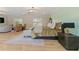 Spacious bedroom suite with hardwood floors, statement lighting, and a comfortable seating area at 2989 Waterford Dr, Conyers, GA 30094