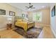 Bedroom with a brass bed frame, stylish lighting, and paneling at 2989 Waterford Dr, Conyers, GA 30094