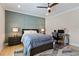 Comfortable bedroom with a ceiling fan, a wainscoted wall, and a dedicated desk space at 2989 Waterford Dr, Conyers, GA 30094