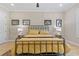 Comfortable bedroom with hardwood floors, paneled walls, and decorative animal artwork at 2989 Waterford Dr, Conyers, GA 30094