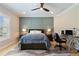 Comfortable bedroom with a ceiling fan, a wainscoted wall, and a dedicated desk space at 2989 Waterford Dr, Conyers, GA 30094
