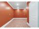 Bonus room with terracotta-colored walls, white trim, and neutral flooring, ideal for any desired activity at 2989 Waterford Dr, Conyers, GA 30094