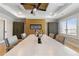 Bright conference room features a modern fireplace, ceiling fan, and large window for natural light at 2989 Waterford Dr, Conyers, GA 30094
