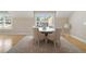 Bright dining room features hardwood floors, modern fan and outdoor views at 2989 Waterford Dr, Conyers, GA 30094