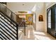 View of the dining room from the stairs, with seating for six under a chandelier at 2989 Waterford Dr, Conyers, GA 30094