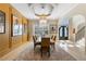 Dining area featuring modern chandelier, neutral color palette, and access to front entry at 2989 Waterford Dr, Conyers, GA 30094