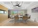 Dining room with coffered ceiling, modern ceiling fan, a large table with seating for eight, and natural light at 2989 Waterford Dr, Conyers, GA 30094
